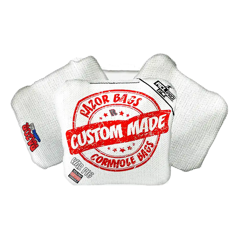 White cornhole bag with red and black text on a white background