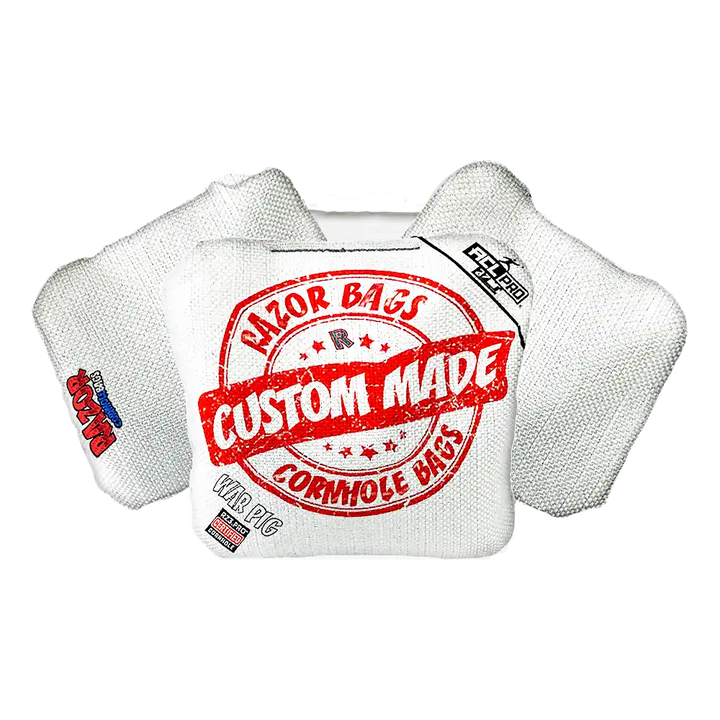 White cornhole bag with red and black text on a white background