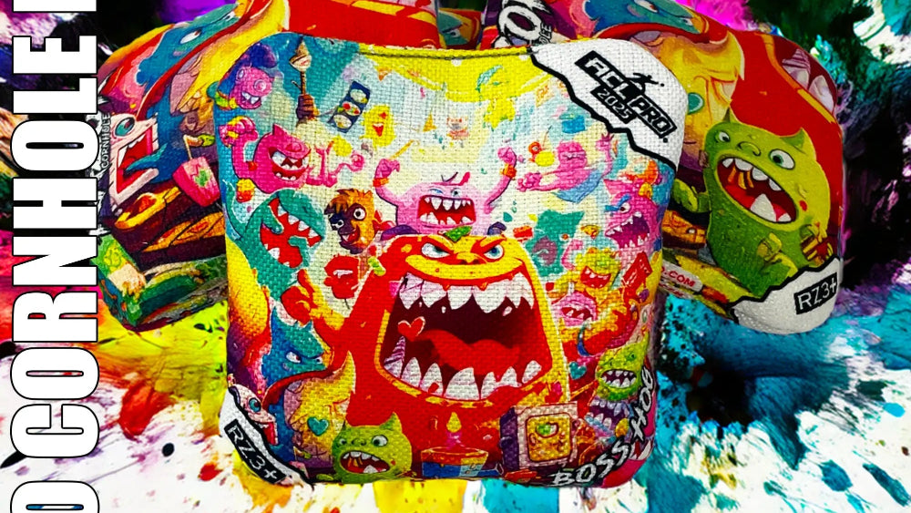 Colorful cornhole bags with cartoon designs on a multicolored splatter background, featuring the Razor brand.