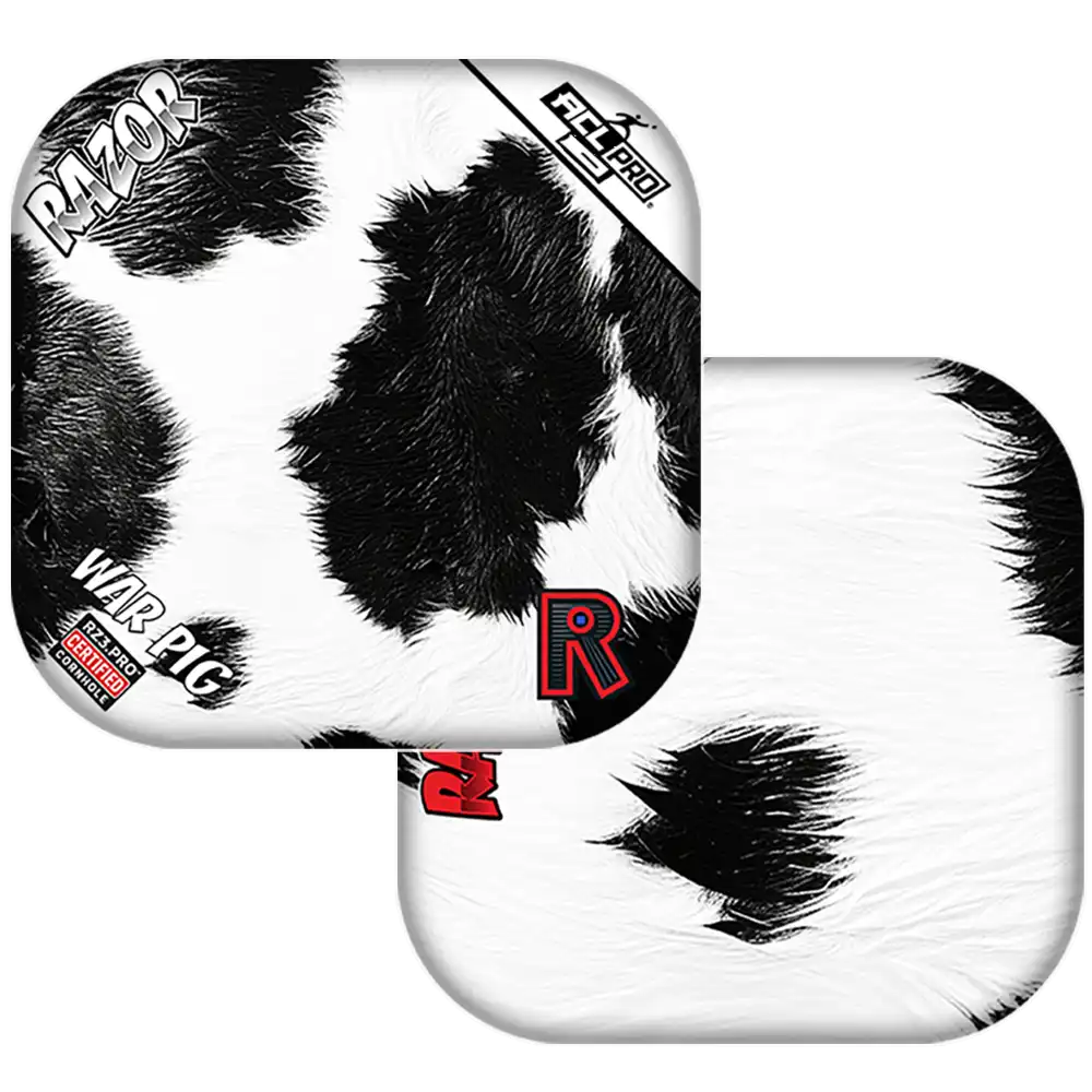 Black and white cow print Cornhole bags with 'Razor' branding on a white background