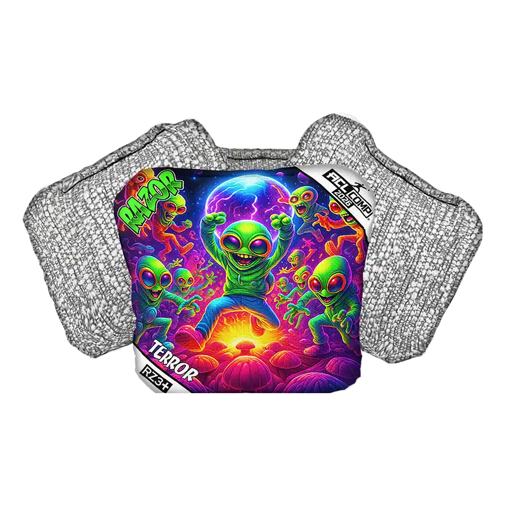 Cornhole bag with colorful alien design on a protective pad with 'Razor' branding.