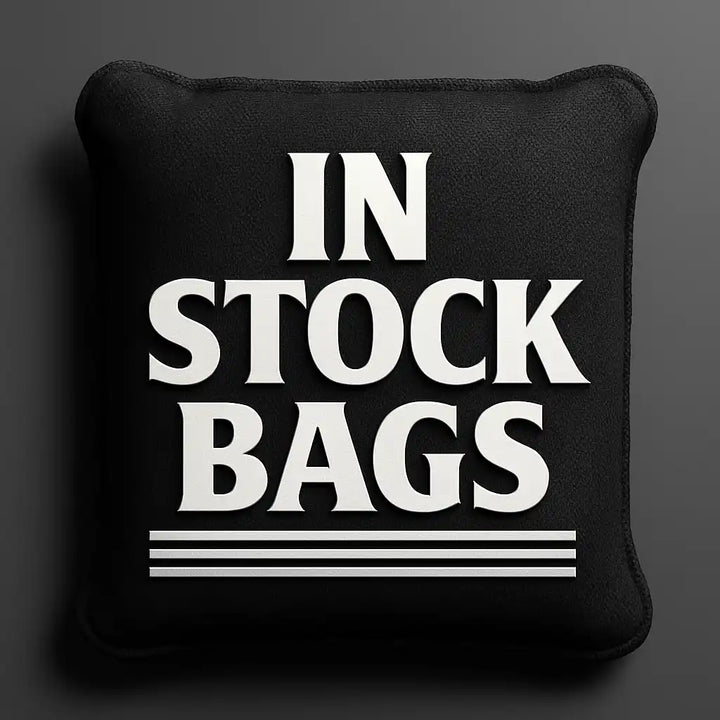 Cornhole bag with 'IN STOCK BAGS' text on a dark background